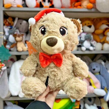 Медведик в червоному святковому капелюху