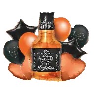 Бутилка напою з чорними та оранжевими кульками