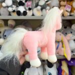 Рожева м'яка іграшка єдинорога